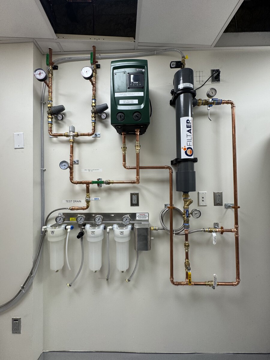 Finished wall-mounted heating and water filtration system